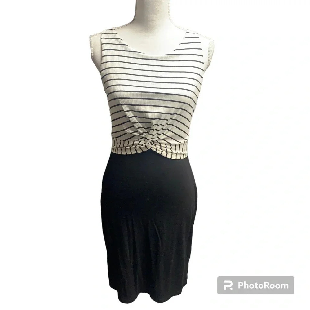 Cherish black/white dress size medium.  Cute twist at the waist very stretchy